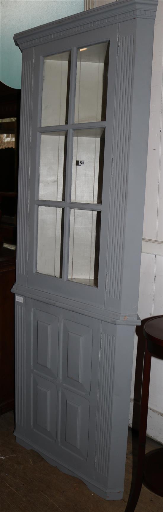 A grey blue painted standing display cabinet